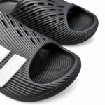 Black and white Adidas Purechill slides, view 3
