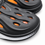 Black and orange clogs with turquoise and white sole, product view 3