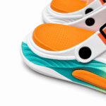 White and orange clogs with lime and turquoise sole, view 3